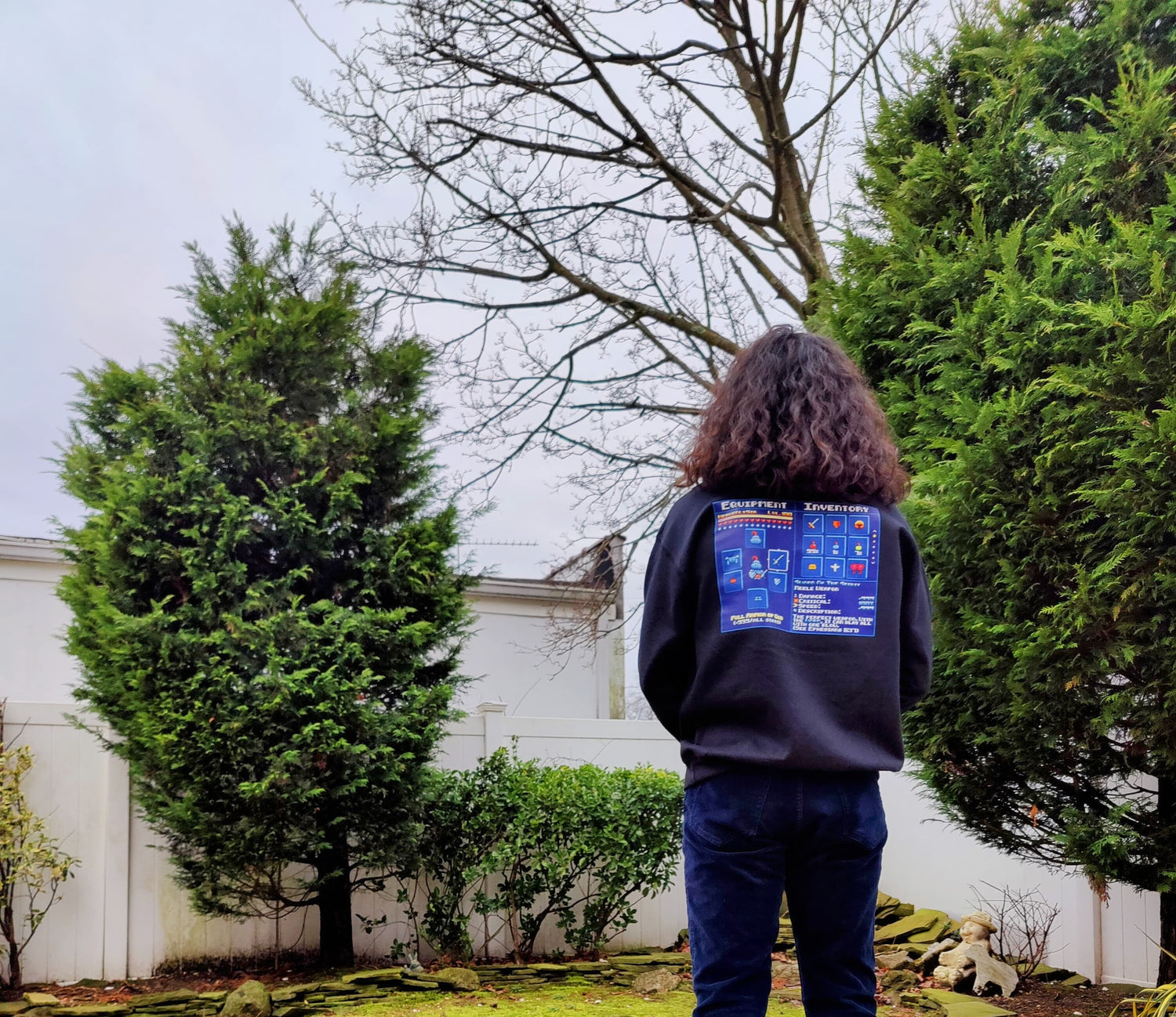 Rene wearing an Armor of God sweatshirt.